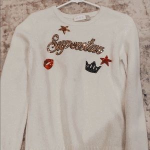 Children place superstar sweater